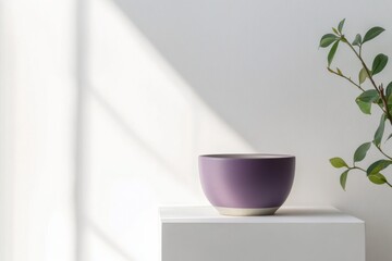 Poster - Elegant purple bowl on a minimalist pedestal with soft natural light and green foliage nearby