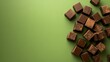 © nayemur - Chocolate Indulgence Dark chocolate chunks scattered across a textured teal background inviting a moment of pure indulgence and the rich flavors of decadent cocoa