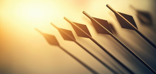 Poster - A close-up of arrows pointed towards the light, showcasing their sharp tips and shadows in a warm, golden hue.