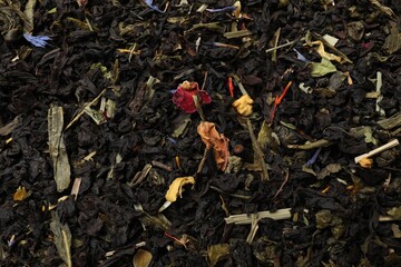 Wall Mural - Pile of dry tea leaves as background, top view