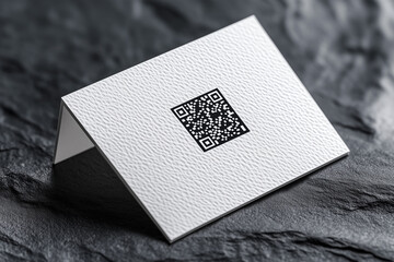 elegant white business card mockup featuring micro-embossed qr code on textured surface