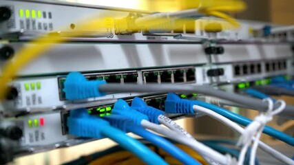 Wall Mural - network server room server rack with fiber optic cables attached to front panel switch ports