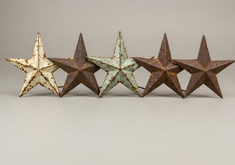 Wall Mural - Rustic metal five stars weathered vintage decor elements isolated on plain background
