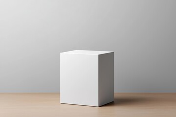 Poster - A minimalistic white cube on a wooden surface, showcasing simplicity and elegance in modern design.