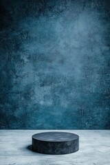 Poster - Minimalistic studio scene featuring a round pedestal against a textured blue wall, ideal for product displays and creative presentations.