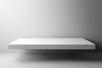 Poster - Minimalist white shelf against a grey wall, creating a clean, modern backdrop for product display or creative photography.
