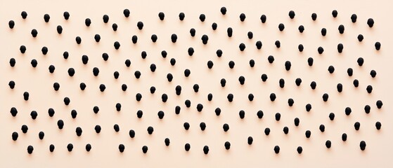 Poster - A minimalistic arrangement of black objects on a soft beige background, creating an abstract and artistic visual effect.