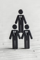 Poster - A creative representation of teamwork and collaboration with wooden figure illustrations in professional attire.