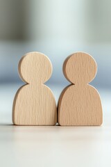 Poster - Two wooden figures symbolizing partnership and teamwork, ideal for concepts of collaboration and community in various projects.