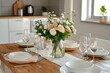 © ChaoticMind - Elegant dining table set with fresh flowers and tableware in a cozy kitchen environment