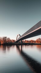 Poster - Modern Arch Bridge Over Calm River with Autumn Foliage Reflections