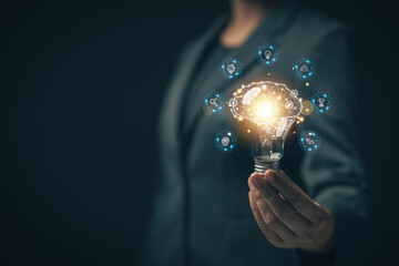 Poster - E-learning graduate certificate program concept.Woman holds a light bulb showing a brain icon. Concept of finding educational opportunities. Education Creativity and problem solving..