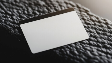 Blank credit card displayed on textured surface, ideal for design use