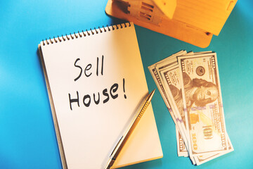 Wall Mural - sell house text on notepad with money