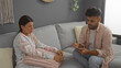 © Krakenimages.com - Woman talking with man during a therapy session in a cozy living room, highlighting intimate conversation and emotional support dynamics indoors