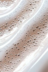 Poster - Water droplets and condensation on smooth curved surface creating abstract diagonal pattern in soft beige and white tones. Macro photography for backgrounds.