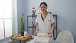 © Krakenimages.com - Beautiful asian woman in a wellness center folding towels in a serene spa room
