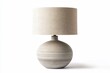 © BerkahStock - Table lamp with a linen shade and a round, textured ceramic base in neutral tones.