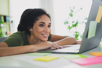 Wall Mural - Photo of lovely young girl working netbook dressed green garment house freelancer home office indoors room