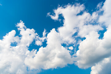 Wall Mural - Blue sky with clouds in the sky. Beautiful blue sky background with clouds.Natural and cloudy fresh blue sky background. White fluffy clouds in the blue sky.