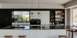 © RaksaLinggo - Modern Kitchen Design with Black and White Cabinets