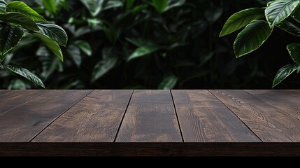 Wall Mural - Dark wood table, lush green leaves background. Product display, nature scene