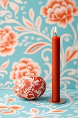 Canvas Print - Decorative Easter egg and lit candle on a floral background.