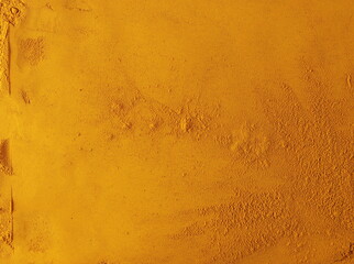 Wall Mural - Turmeric powder pile background and texture, top view	