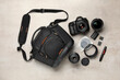 © New Africa - Professional photographer's equipment and case on light background, flat lay