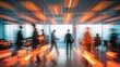 © demzp - Blurred silhouettes of business professionals suggest a dynamic and collaborative office environment.