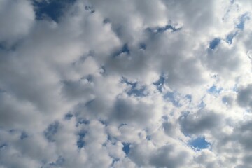 Wall Mural - stratocumulus clouds covered blue sky, natural cloudscape