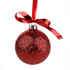 Wall Mural - Red Christmas ball with ribbon on white background 