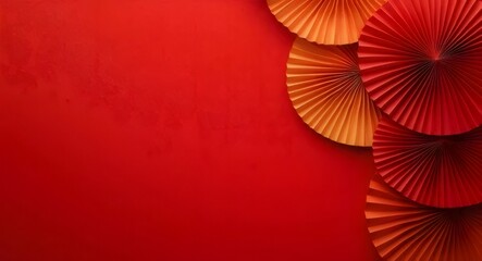 Wall Mural - Red and orange paper fans on red background. (1)