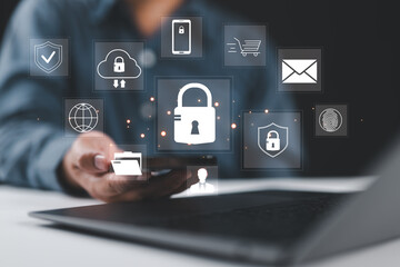 Fototapete - Businessman using a laptop select the icon security on the virtual display to Data protection Cyber Security Privacy Business Internet, and Networking Technology concept.