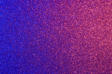 a blue and pink background with a lot of glitter