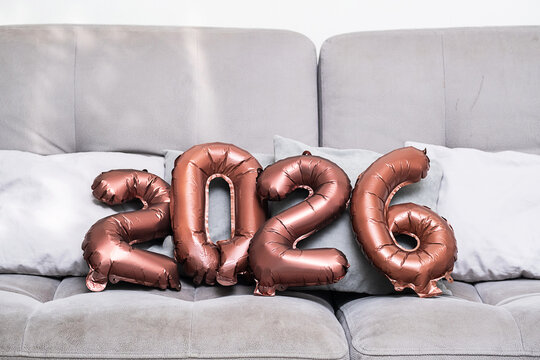 2026 Number Balloons on Modern Sofa, for Future Celebration.