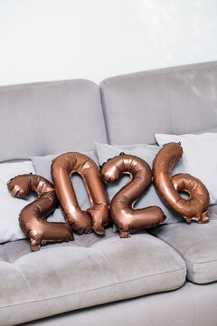 2026 Number Balloons on Modern Sofa, for Future Celebration.