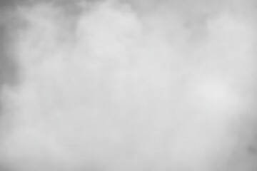 Wall Mural - soft wisps of white smoke flowing across a gray background