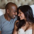 © Clearmind - Mixed couple, Indian woman and black man smiling at each other in bed. Square photography