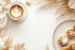 © Odrua Design - Xícara de café elegante com detalhes dourados, acompanhada de doces e decorações festivas em fundo branco, criada com IA generativa para um visual sofisticado e convidativo