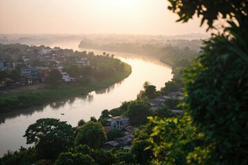 Wall Mural - Sunrise view of river flowing by town in scenic landscape for travel backgrounds