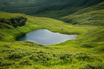 Wall Mural - Scenic lake surrounded by vibrant green hills, for nature and travel ads