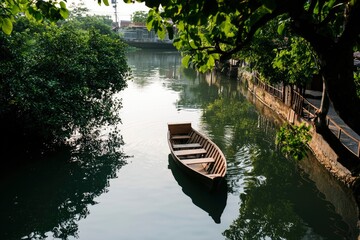 Wall Mural - Boat floats on canal, houses line bank, trees frame scene, serene travel setting