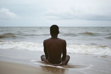 Wall Mural - Black person beach outdoors sitting.