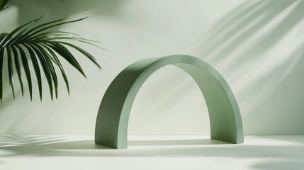 Poster - A soft green arch stands gracefully on a clean, light surface, surrounded by gentle shadows and tropical leaves, embodying serene minimalism and modern design