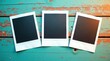 © wichit - Three blank instant photo frames arranged on a weathered teal wooden surface.
