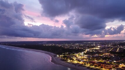 Wall Mural - coastal city at dusk with vibrant lights