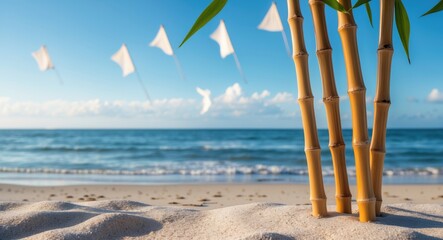 Poster - Bamboo stalks in foreground on sandy beach with ocean waves and white flags in background under clear blue sky Copy Space