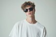 © ttonaorh - A male fashion model wearing a white oversized t-shirt and sunglasses, in a high-resolution, highly detailed, full-body photo shoot for an editorial in magazine