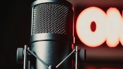Poster - Studio microphone recording audio content with a luminous on air sign in the background, creating a captivating slow motion sequence perfect for podcasts, broadcasts, and online content creation